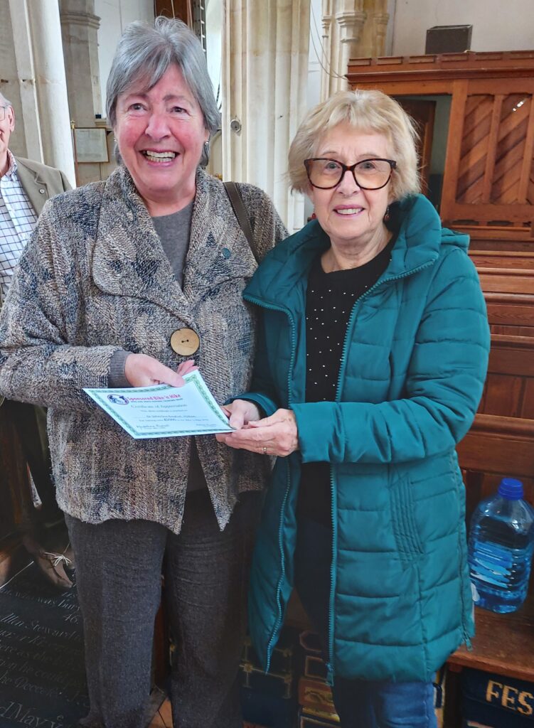 Margaret Butt receiving certificate
