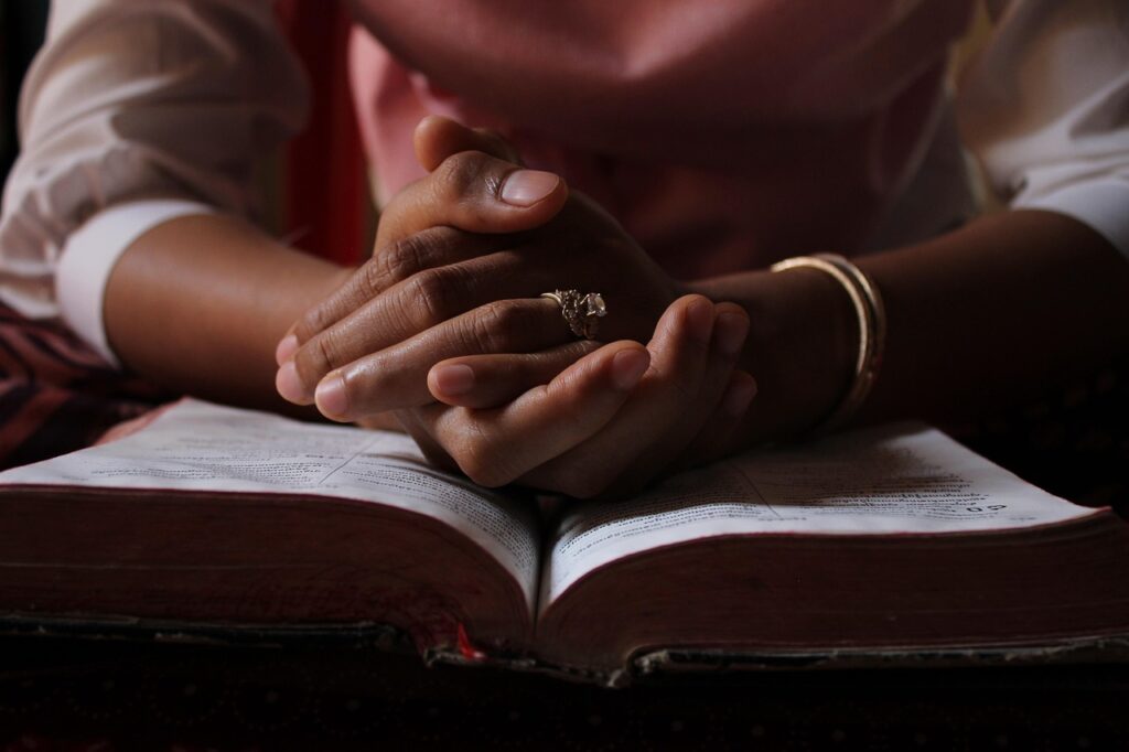Praying hands & bible